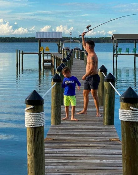 Son and Father fishing off a dock in Alligator Point