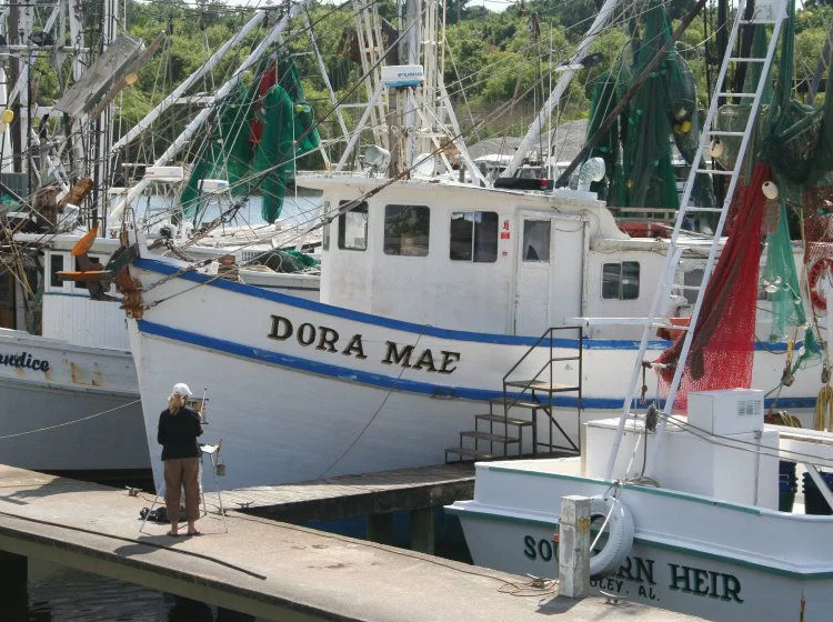 Artist Painting Shrimp Boats in Apalachicola FL